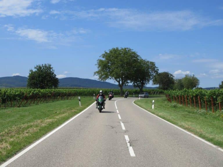 Image of motorbikes riding down country road