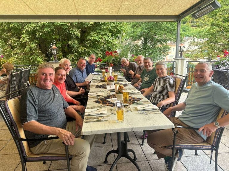 Image of group on motorcycle holiday enjoying a meal